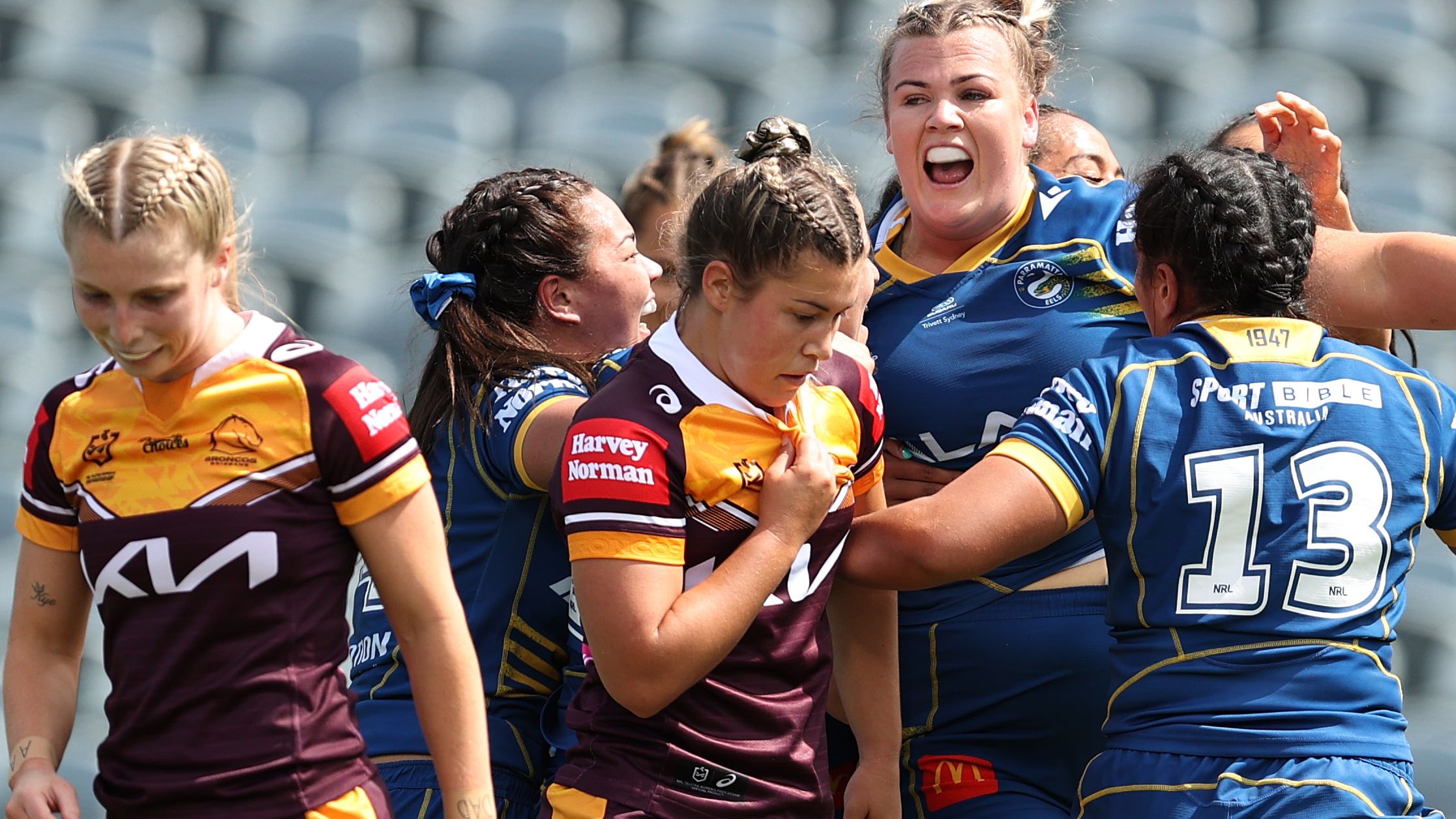Ellie Johnston of the Eels celebrates a try against the Broncos.