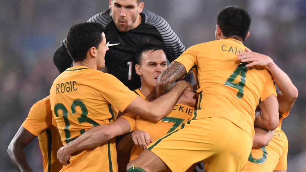 Socceroos down Greece with late strike