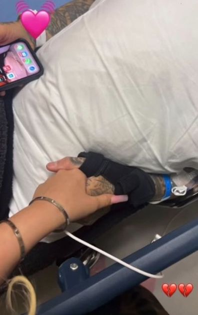 Travis Barker's daughter Alabama Barker shares photo of rocker being hospitalized.