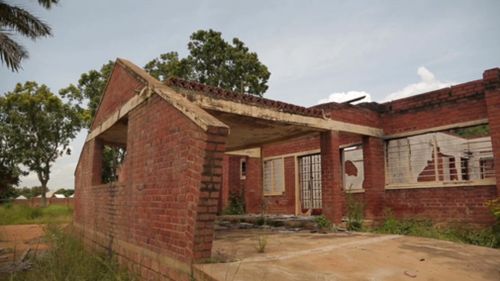 The brick walls stood like relics, strangely contrasting with the distant green hills. Those distant hills were making our local guides nervous. 