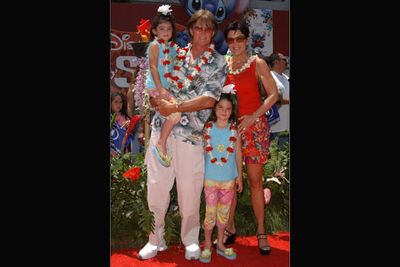 With daughters Kendall and Kylie at the Lilo & Stitch premiere in 2002.