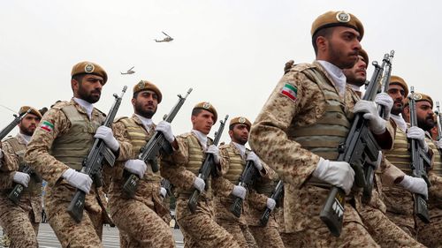 Troops march during the army parade commemorating National Army Day in front of the shrine of the late revolutionary founder Ayatollah Khomeini, just outside Tehran, Iran.