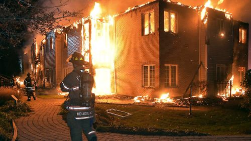 Firefighters battle a blaze at the Barclay Friends Senior Living Community in West Chester, Pennsylvania. (AAP)