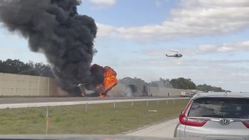 Smoke and fire fills the air after an airplane crashed on Interstate 75,  Friday, Feb. 10, 2024 near Naples, Fla.   