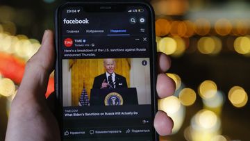 The app of Facebook showing US President Joe Biden speaking, is viewed on an smartphone in Moscow, Russia.