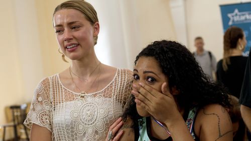 Amber Heard in tears as Johnny Depp helps South American children hear for the first time