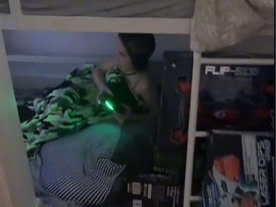 Kid playing inside a gaming den