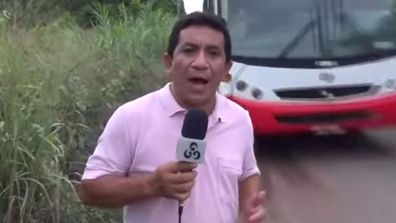 Bus gives TV journo a close shave during report (Gallery)