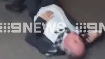 Barnaby Joyce has been captured lying on a pavement in Canberra by an onlooker.