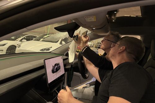 SA Museum experts Tom Bain and Tom Pyrakowski examine the car.