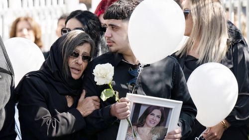 Lametta Fudlallah's mother and son at St Charbel's Maronite Church