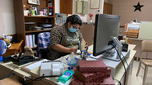 Vicky Zapata, who works for the city, has helped lead prayer vigils for COVID-19 victims and organise food deliveries for those in quarantine.