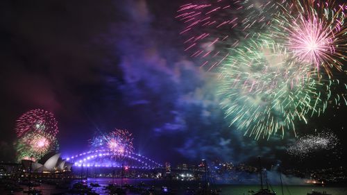 Fireworks explode over Sydney Harbour during New Year's Eve celebrations in Sydney. (AAP)
