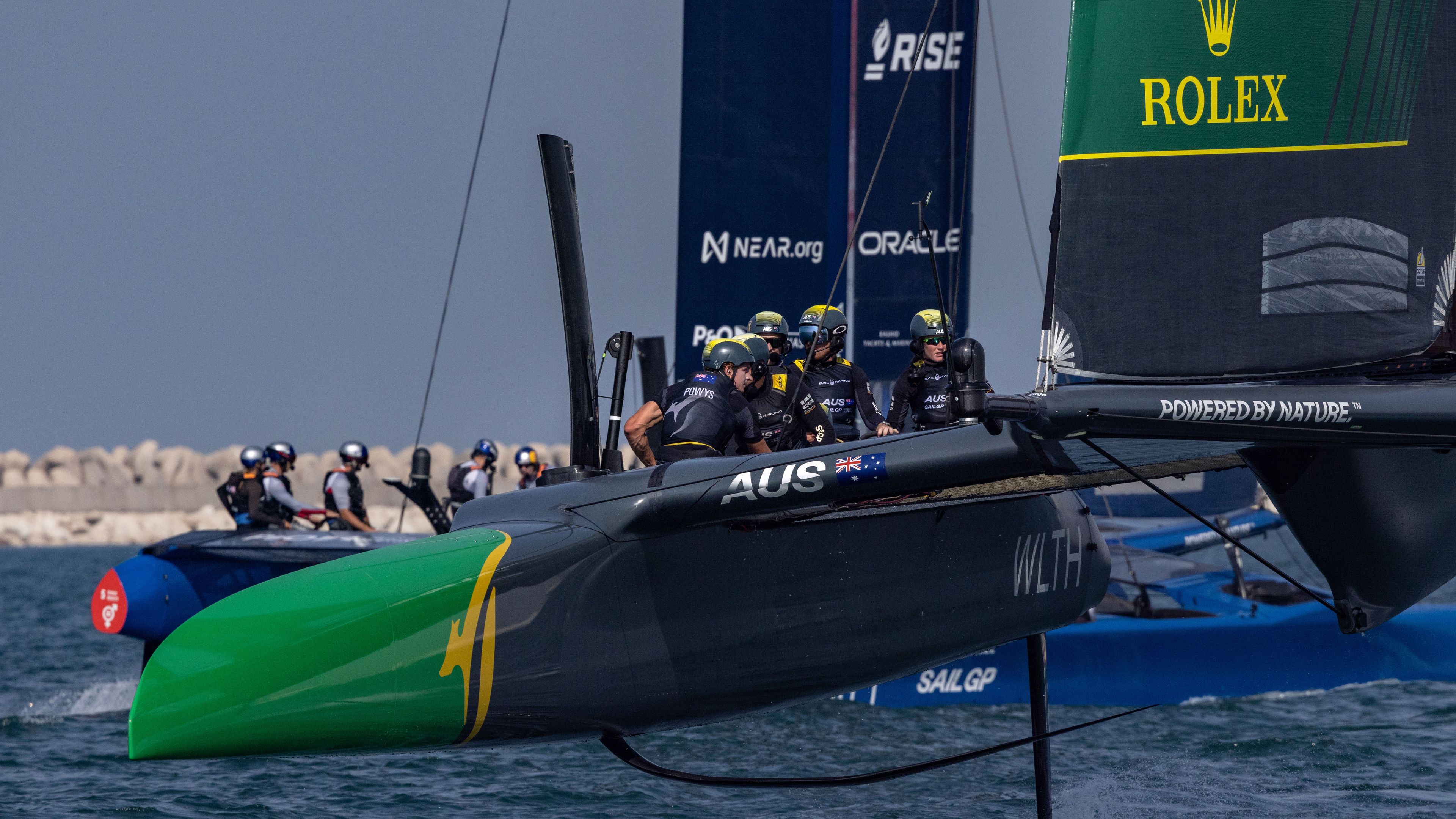 Australia&#x27;s SailGP team helmed by Tom Slingsby in action as they sail past USA during a practice session.