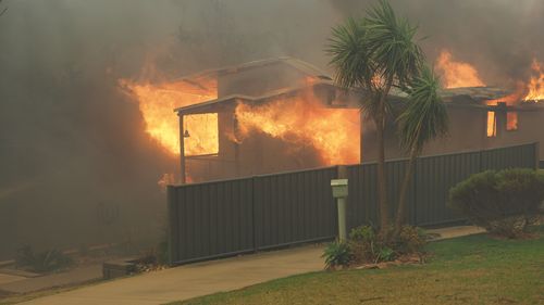 A home well and truly alight in Tathra. Picture: Supplied