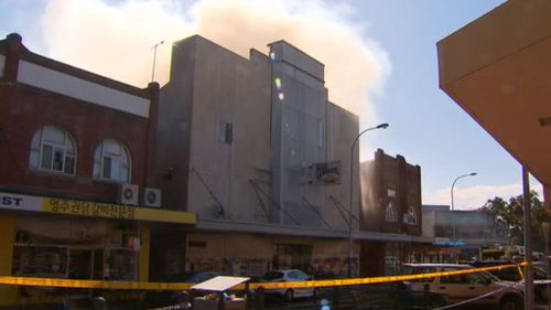 The fire reportedly started in the roof of the Grand Westella Centre in Lidcombe, NSW. (9NEWS)
