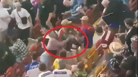 A brawl breaks out in the crowd at Suncorp Stadium during Friday night&#x27;s Magic Round matches.
