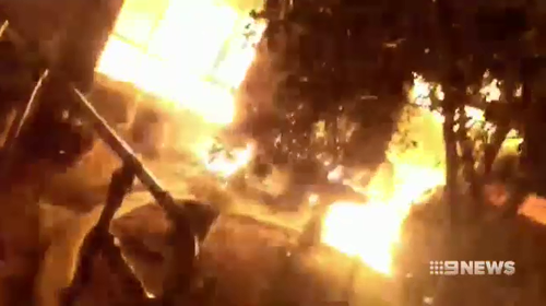 A neighbour filmed the blaze with his phone as he ran to see if anyone was inside.