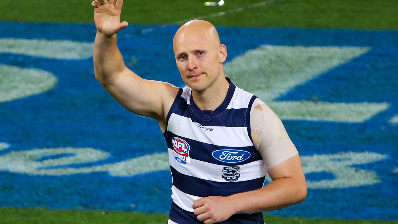 Gary Ablett of the Cats leaves the field for the last time
