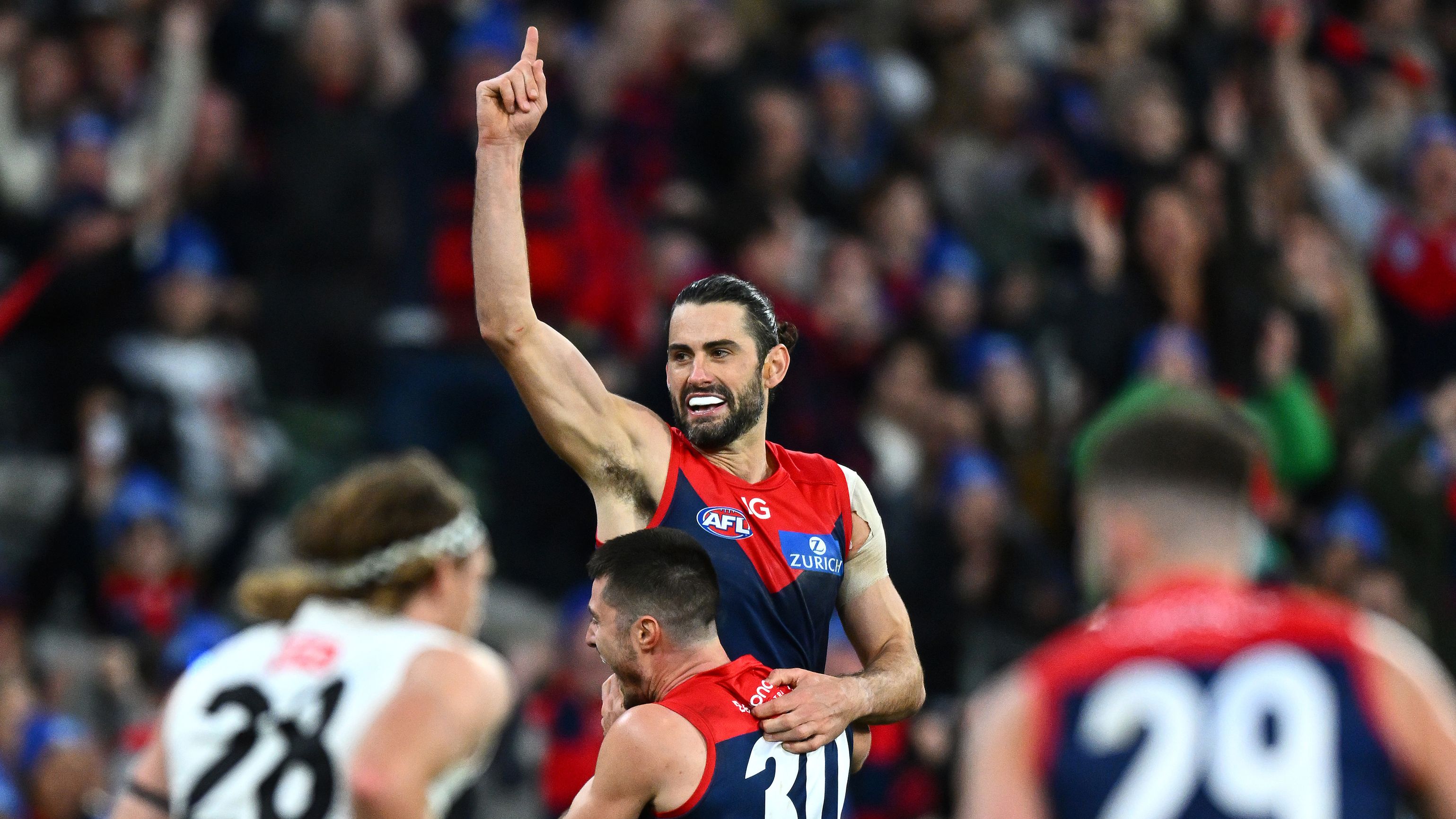 MELBOURNE, AUSTRALIA - JUNE 12: Brodie Grundy of the Demons is congratulated by Alex Neal-Bullen after kicking a goal during the round 13 AFL match between Melbourne Demons and Collingwood Magpies at Melbourne Cricket Ground, on June 12, 2023, in Melbourne, Australia. (Photo by Quinn Rooney/Getty Images)