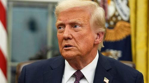 President Donald Trump signs executive orders in the Oval Office of the White House, Jan. 20, 2025, in Washington.