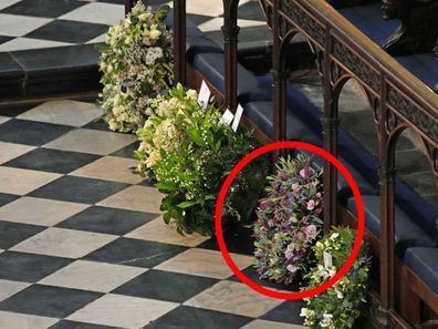 Meghan and Harry's wreath for the Duke of Edinburgh's funeral. Wreaths from members of the royal family lie against the pews during the funeral of Prince Philip, Duke of Edinburgh at Windsor Castle on April 17, 2021 in Windsor, United Kingdom