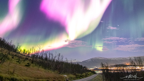 The sky above Norway dazzled with vibrant pinks and purples after a solar storm tore temporary holes in Earth's magnetic field. 