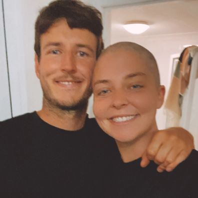 Alexandra Jansen lost her hair during cancer treatment. Seen here with her partner.