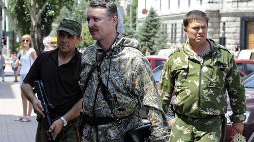 Commander and self-proclaimed minister of Defence of so the called 'Donetsk People's Republic' Igor Girkin, aka Strelok, walks with his bodyguards in the eastern Ukrainian city of Donetsk on July 11, 2014. (Getty)