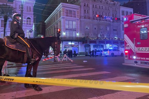 A mounted police officer arrives on Canal Street after a vehicle drove into a crowd earlier in New Orleans, Wednesday Jan. 1, 2025.  