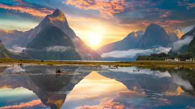 Famous Mitre Peak rising from the Milford Sound fiord. Fiordland national park, New Zealand.