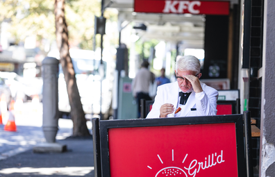 Man dress as KFC's Colonel spotted eating healthier fried chicken at a Grill'd store.