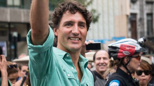 PM Trudeau waves at attendees. (AFP)
