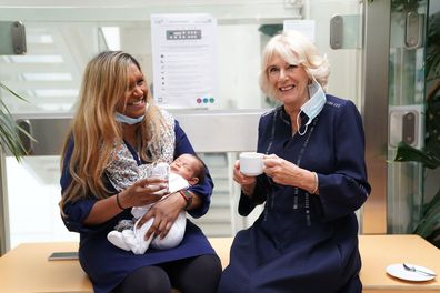  Camilla, Queen Consort talks to SafeLives pioneer Shana Begum and her 3-week-old baby, Jeremy, during a visit to a maternity unit at Chelsea and Westminster hospital in London to meet key domestic abuse frontline staff on October 13, 2022 in London, England.  