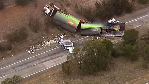 It hit several vehicles, including a ute, whose driver was trapped inside, police said.