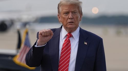 President Donald Trump gestures after arriving on Air Force One, Wednesday, June 25, 2025, at Joint Base Andrews, Md. (AP Photo/Alex Brandon)