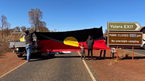 Locals created a blockade at the entrance to Uluru-Kata Tjuta National Park today.