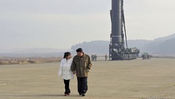 North Korea has unveiled the little-known daughter of its leader Kim Jong Un at a missile launch site.