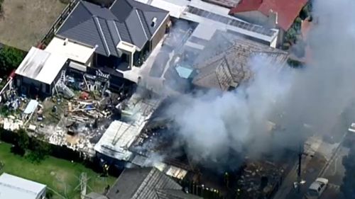 Two people have suffered burns in a house fire at Glenroy, in Melbourne's north. (9NEWS)