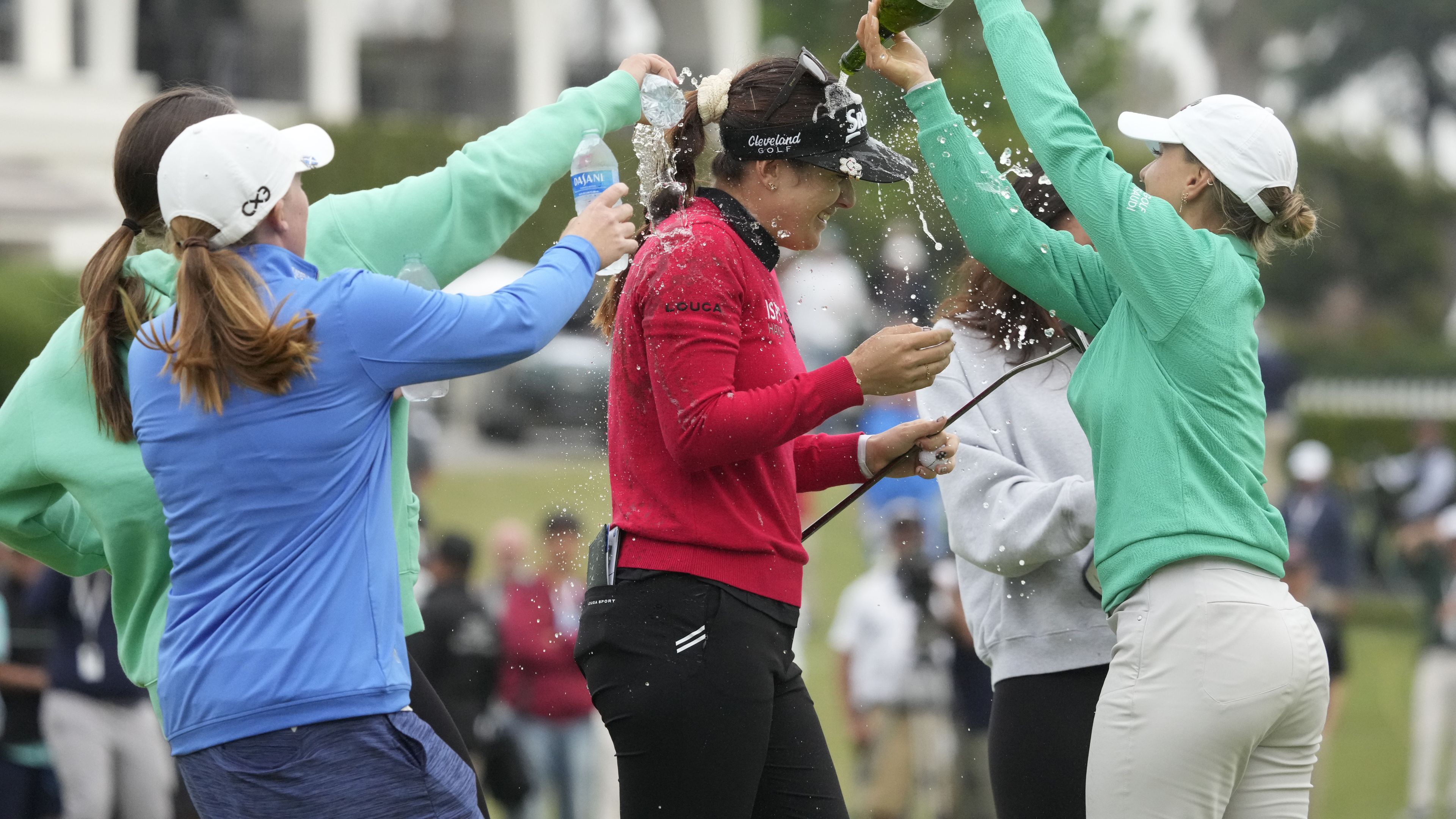Hannah Green is doused on the 18th green after winning in a playoff at the LPGA LA Championship.