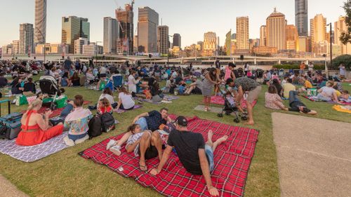 Crowds gather to watch the fireworks show in Brisbane.