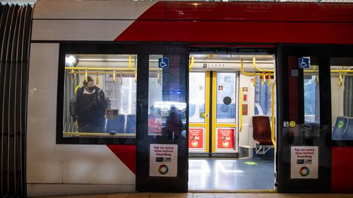Commuters travelling on the Light rail. Central Station. Sydney. Generic Public transport. Coronavirus COVID-19. 20th July 2021 Photo Louise Kennerley