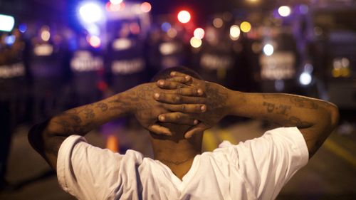 Protesters have defied a 10pm curfew to remain on Baltimore's streets. (AFP)