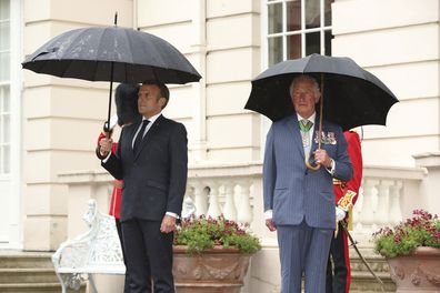 Prince Charles welcomes French president Emmanuel Macron, left, to Clarence House in London, Thursday June 18, 2020.