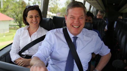 LNP leader Tim Nicholls (right) and deputy leader Deb Frecklington on the campaign bus. (AAP)