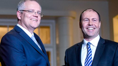 Prime Minister Scott Morrison and Deputy Liberal leader Josh Frydenberg after the swearing in ceremony at Government House in Canberra. 