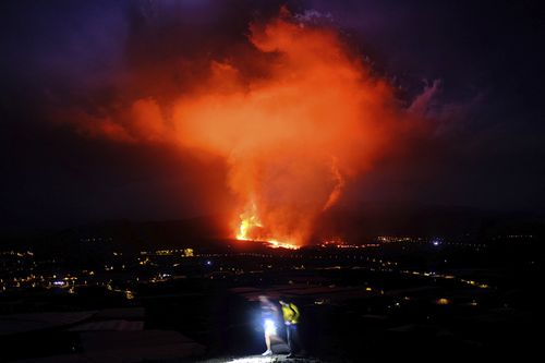 Lava spews from a volcano on the Canary island of La Palma, Spain