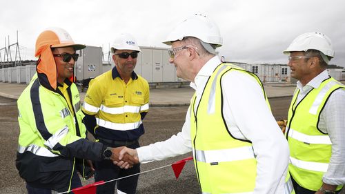 Prime Minister Anthony Albanese and WA Premier Roger Cook meet with workers during a visit to view the Collie Battery Energy Storage System at the Collie Power Station, in the electorate of O'Connor, in Collie, WA, on Wednesday 23 April 2025, during the 2025 federal election campaign.