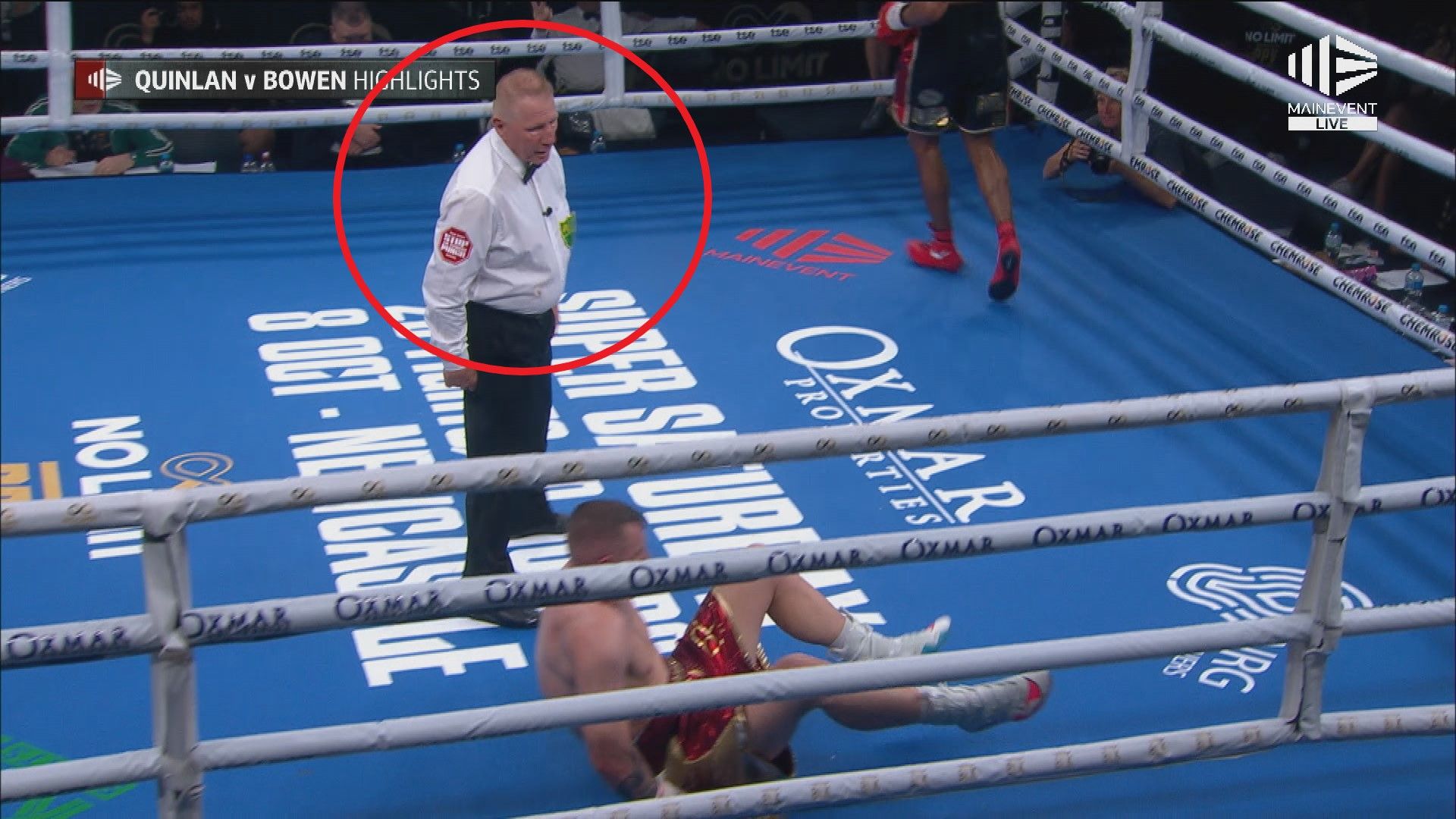 The fight referee stands over Jack Bowen after he was clobbered by Renold Quinlan.