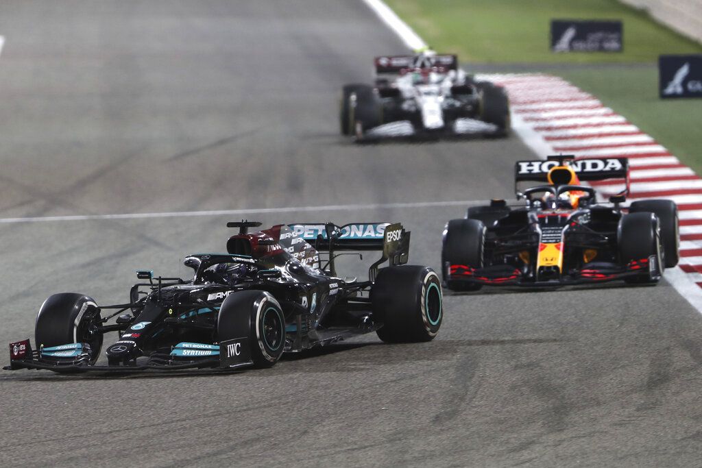 Mercedes driver Lewis Hamilton of Britain steers his car followed by Red Bull driver Max Verstappen of the Netherlands during the Bahrain Formula One Grand Prix at the Bahrain International Circuit in Sakhir.